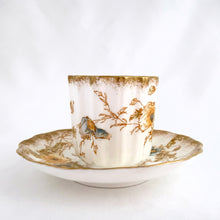 Load image into Gallery viewer, Antique Victorian style "Rutland" demitasse cup and saucer, with blue and yellow flowers trimmed in gold gilt. Crafted by Doulton Burslem, Staffordshire England, circa 1891 - 1902. An absolutely stunning addition to your teacup collection! In excellent condition, free from chips/cracks/repairs. Makers marks present. Cup measures 2 1/8 x 2 1/8 inches and saucer is approximately 4 inches