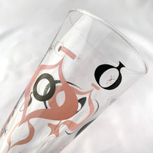Load image into Gallery viewer, Make any day a special occasion with these highly collectible and hard to find vintage mid-century atomic style Seville pilsner or champagne glasses. Decorated with a graphic geometric design in swirls of pink, charcoal black and gold, they remind us of a New Year's eve party and are perfect for that midnight champagne toast! Bonus, they come in the original wood handled brass caddy.