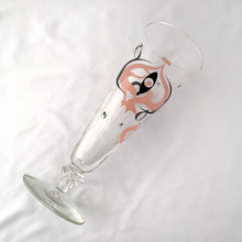 Load image into Gallery viewer, Make any day a special occasion with these highly collectible and hard to find vintage mid-century atomic style Seville pilsner or champagne glasses. Decorated with a graphic geometric design in swirls of pink, charcoal black and gold, they remind us of a New Year's eve party and are perfect for that midnight champagne toast! Bonus, they come in the original wood handled brass caddy.