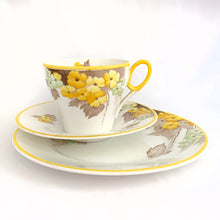 Load image into Gallery viewer, Lovely vintage Phlox Yellow Trim teacup, saucer and salad plate trio. Produced by Shelley, England. Circa 1940. In excellent vintage condition, free from chips/cracks. Minor manufacturer's defect on rim of salad plate and underside has slight discoloration (see photos). Cup measures 3-1/4" x 2-5/8" with registration mark "795072" and a green infinity sign. Saucer measures 5-3/8" marked "071 D" Plate measures 6-7/8" "IDEAL CHINA No. C.R.071" yellow "C" 2 dots