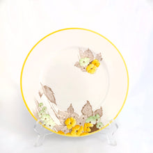 Load image into Gallery viewer, Lovely vintage Phlox Yellow Trim teacup, saucer and salad plate trio. Produced by Shelley, England. Circa 1940. In excellent vintage condition, free from chips/cracks. Minor manufacturer's defect on rim of salad plate and underside has slight discoloration (see photos). Cup measures 3-1/4" x 2-5/8" with registration mark "795072" and a green infinity sign. Saucer measures 5-3/8" marked "071 D" Plate measures 6-7/8" "IDEAL CHINA No. C.R.071" yellow "C" 2 dots