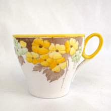 Load image into Gallery viewer, Lovely vintage Phlox Yellow Trim teacup, saucer and salad plate trio. Produced by Shelley, England. Circa 1940. In excellent vintage condition, free from chips/cracks. Minor manufacturer's defect on rim of salad plate and underside has slight discoloration (see photos). Cup measures 3-1/4" x 2-5/8" with registration mark "795072" and a green infinity sign. Saucer measures 5-3/8" marked "071 D" Plate measures 6-7/8" "IDEAL CHINA No. C.R.071" yellow "C" 2 dots