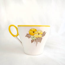 Load image into Gallery viewer, Lovely vintage Phlox Yellow Trim teacup, saucer and salad plate trio. Produced by Shelley, England. Circa 1940. In excellent vintage condition, free from chips/cracks. Minor manufacturer's defect on rim of salad plate and underside has slight discoloration (see photos). Cup measures 3-1/4" x 2-5/8" with registration mark "795072" and a green infinity sign. Saucer measures 5-3/8" marked "071 D" Plate measures 6-7/8" "IDEAL CHINA No. C.R.071" yellow "C" 2 dots