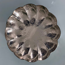 Load image into Gallery viewer, Sweet vintage silver plate scalloped shaped dish beautifully engraved with a pattern of shells and hearts. Marked EP Copper along with a shield with an "R" for Roden Bros. Ltd. The perfect piece to brighten up a vanity table to hold trinkets, in a powder room to display fancy soaps or in an entryway filled with treats. In good vintage condition. Measures 4" x 1/2"