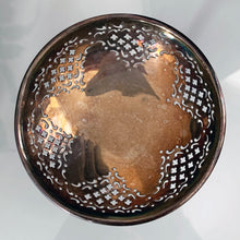 Load image into Gallery viewer, Vintage silver plated pedestal dish with lovely pierced detail giving the dish a doily-like effect and a heavy weighted stem and foot. We left this piece just as we found it. Polish as desired to a brilliant finish. The perfect piece to brighten up a vanity table to hold trinkets, in a powder room to display fancy soaps or in an entryway or on a side table filled with treats. In good vintage condition. Marked EPNS. 4-3/4" x 3-1/2"