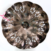Load image into Gallery viewer, Vintage silver plated scalloped edge pedestal dish with lovely pierced detail giving the dish a doily-like effect along with an engraved pattern. Has a little light wear and tarnish, we left it just as we found it and could easily be polished if a brilliant finish is desired. The perfect piece to brighten up a vanity table to hold trinkets, in a powder room to display fancy soaps or in an entryway filled with treats. In good vintage condition. Marked EPNS, "R" within a shield. 4" x 2-1/8"
