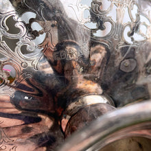 Load image into Gallery viewer, Vintage silver plated scalloped edge pedestal dish with lovely pierced detail giving the dish a doily-like effect along with an engraved pattern. Has a little light wear and tarnish, we left it just as we found it and could easily be polished if a brilliant finish is desired. The perfect piece to brighten up a vanity table to hold trinkets, in a powder room to display fancy soaps or in an entryway filled with treats. In good vintage condition. Marked EPNS, "R" within a shield. 4" x 2-1/8"