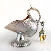 Load image into Gallery viewer, This vintage silver plated sugar scuttle and scoop set, embossed with roses, flowers, leaves and scroll details No 540. It's just a beautiful vessel for sugar cubes or bath salts. Produced by Leonard Manufacturing Ltd. in Japan. In good vintage condition. In original box. Measures approx. 6-1/4" x 3.5" x 6"