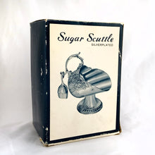 Load image into Gallery viewer, This vintage silver plated sugar scuttle and scoop set, embossed with roses, flowers, leaves and scroll details No 540. It's just a beautiful vessel for sugar cubes or bath salts. Produced by Leonard Manufacturing Ltd. in Japan. In good vintage condition. In original box. Measures approx. 6-1/4" x 3.5" x 6"