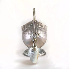 Load image into Gallery viewer, This vintage silver plated sugar scuttle and scoop set, embossed with roses, flowers, leaves and scroll details No 540. It's just a beautiful vessel for sugar cubes or bath salts. Produced by Leonard Manufacturing Ltd. in Japan. In good vintage condition. In original box. Measures approx. 6-1/4" x 3.5" x 6"