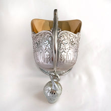 Load image into Gallery viewer, This vintage silver plated sugar scuttle and scoop set, embossed with roses, flowers, leaves and scroll details No 540. It's just a beautiful vessel for sugar cubes or bath salts. Produced by Leonard Manufacturing Ltd. in Japan. In good vintage condition. In original box. Measures approx. 6-1/4" x 3.5" x 6"