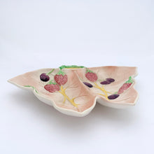 Load image into Gallery viewer, Vintage butterfly shaped ceramic divided dish in pale pink featuring raised decorations of strawberries and cherries. Crafted by Avonware, England, 1950s. A lovely dish for serving candies and nuts or use as a trinket dish.
In excellent condition, no chips/cracks/repairs.
Measures 9 x 7 x 1 1/4 inches