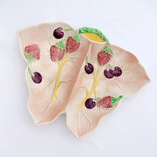 Load image into Gallery viewer, Vintage butterfly shaped ceramic divided dish in pale pink featuring raised decorations of strawberries and cherries. Crafted by Avonware, England, 1950s. A lovely dish for serving candies and nuts or use as a trinket dish.
In excellent condition, no chips/cracks/repairs.
Measures 9 x 7 x 1 1/4 inches