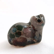 Load image into Gallery viewer, Vintage miniature Tonala folk art pottery cat figurine in gray with a nicely detailed face in black and brown with the body in pink, black and green florals. Crafted in Mexico, 1960s. A sweet piece to add to your collection!
In excellent condition, no chips or cracks. Signed MEX.
Measures 1 1/4 x 3/4 x 1 5/8 inches