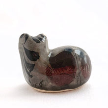 Load image into Gallery viewer, Vintage miniature Tonala folk art pottery cat figurine in gray with a nicely detailed face in black and brown with the body in pink, black and green florals. Crafted in Mexico, 1960s. A sweet piece to add to your collection!
In excellent condition, no chips or cracks. Signed MEX.
Measures 1 1/4 x 3/4 x 1 5/8 inches