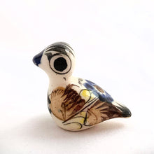 Load image into Gallery viewer, Beautiful Mexican Tonala miniature folk art pottery duck bird figurine. This hand painted figurine is white with a nicely detailed face in black and blue with the body in yellow, blue and brown florals. Signed "MEX".  In excellent condition, no chips or cracks.  Measures approximately 1" x 1-1/2" x 1-1/4" tall