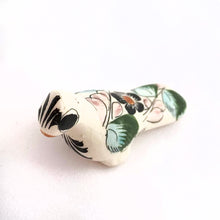 Load image into Gallery viewer, Vintage miniature Tonala folk art pottery Partridge figurine, hand painted in white, detailed in black, tan, blue, prink and green florals. Crafted in Mexico, 1960s. A sweet piece to add to your collection!
In excellent condition, no chips or cracks. Signed MEX.
Measures 2 3/8 x 7/8 x 1 3/8 inches