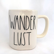 Load image into Gallery viewer, An authentic Rae Dunn Artisan Collection mug with the word "WANDERLUST" in their distinct font. Produced by Magenta. Perfect for your morning, noon or nighttime cuppa joe! In mint condition. Measures 5 x 4 1/2 (includes handle) Capacity 16oz