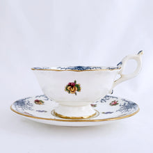 Load image into Gallery viewer, Antique bone china teacup and saucer with scalloped edge and decorated with hand painted pansies and roses with a blue graphic plant and rimmed with gold gilt. Produced by Coalport, England, circa 1900. In good condition, free from chips, cracks and repairs. Manufacturer's defect to the right of the handle at the rim. Pattern number 8252 and maker's marks are on the bottom of the teacup and maker's mark on the saucer. Teacup measures 4" x 2-1/8" | Saucer measures 5-3/4"