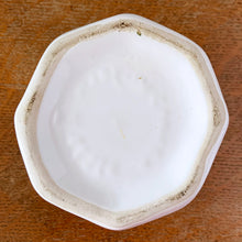 Load image into Gallery viewer, Vintage eight panel white ceramic planter with a basketweave pattern bordered with thick bands. Produced in Canada. In excellent condition, free from chips/cracks. Marked on the bottom, but we are unable to decipher except for the word "CANADA". Measures 5-1/8" x 4-1/4"