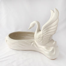 Load image into Gallery viewer, A lovely majestic white swan perched at the water's edge of this large white planter. The perfect home for a favourite houseplant or succulent, or use as a candy dish....so pretty! No makers mark, but likely made in the USA by American Bisque. In excellent condition, free from chips and cracks, slight crazing. Measures 11-1/2" x 6" x 8-1/2"