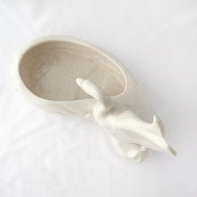 Load image into Gallery viewer, A lovely majestic white swan perched at the water's edge of this large white planter. The perfect home for a favourite houseplant or succulent, or use as a candy dish....so pretty! No makers mark, but likely made in the USA by American Bisque. In excellent condition, free from chips and cracks, slight crazing. Measures 11-1/2" x 6" x 8-1/2"