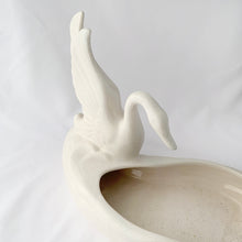 Load image into Gallery viewer, A lovely majestic white swan perched at the water's edge of this large white planter. The perfect home for a favourite houseplant or succulent, or use as a candy dish....so pretty! No makers mark, but likely made in the USA by American Bisque. In excellent condition, free from chips and cracks, slight crazing. Measures 11-1/2" x 6" x 8-1/2"