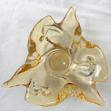 Load image into Gallery viewer, A stunning 3 point trillium shaped yellow art glass ashtray or bowl. This is a beautifully hand blown glass ashtray with lots of twists and turns of the glass. Makes a beautiful addition to home decor. Use as trinket dish, catchall, candy dish or as originally intended. Made by Lorraine Glass in Canada, circa 1970. It is absolutely spectacular piece of art glass! In excellent condition, no chips or cracks and the bottom is polished smooth. Measures 9" x 3-7/8"