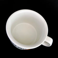 Load image into Gallery viewer, Vintage Designers Collection Ziggy comic stoneware mug. This heavy stoneware mug is white with a red stripe around the rim along with Ziggy and his colourful group of furry friends with the phrase "Soups On“ in a cartoon speech bubble. The perfect mug for your favourite cup of soup! Designed by cartoonist Tom Wilson for Universal Press Syndicate. Made in Korea, 1982. In excellent condition, free from chips/cracks/wear. Appears to not have been used. Measures 4 x 2-7/8 inches Capacity 12 ounces