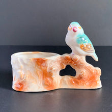 Load image into Gallery viewer, Vintage hand painted planter featuring an aqua and amber perched on a branch. Crafted in Japan, 1950s. A sweet decor piece for a small succulent, to hold toothpicks or matches.
In excellent condition, no chips. Marked Hand Painted Japan 1950s.
Measures 5 x 1 3/4 x 3 1/2 inches