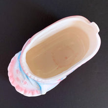 Load image into Gallery viewer, Vintage white ceramic baby bootie planter with blue bows and pink details. Crafted by Rubens Originals, Japan, 1950s. A perfect addition to nursery decor to hold a plant or baby accessories!
Excellent condition, no chips or cracks. Marked on the bottom.
Measures 4 x 2 1/4 x 2 1/2 inches
