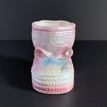 Load image into Gallery viewer, Vintage white lustreware ceramic baby bootie planter with pink bows and edge details, and a hint of blue. Crafted by Rubens Originals, Japan, 1950s. Adorable in a baby's nursery to house a small houseplant or use it to store accessories!
In excellent condition, no chips or cracks. Maker's mark.
Measures 4 x 4 x 3 inches