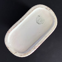Load image into Gallery viewer, Vintage white lustreware ceramic baby bootie planter with pink bows and edge details, and a hint of blue. Crafted by Rubens Originals, Japan, 1950s. Adorable in a baby's nursery to house a small houseplant or use it to store accessories!
In excellent condition, no chips or cracks. Maker's mark.
Measures 4 x 4 x 3 inches