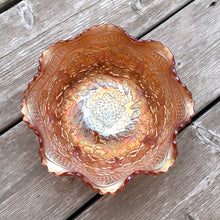 Load image into Gallery viewer, Lovely vintage "Two Flowers" iridescent marigold carnival glass bowl featuring Dogwood and Marsh Lily flowers with fluted edge on three spatulate feet. Crafted by Fenton Art Glass, USA, circa 1920s. A sweet piece for any Fenton collector! In excellent condition, free from chips. Measures 7 5/8 x 3 3/4 inches