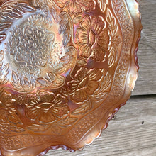 Load image into Gallery viewer, Lovely vintage "Two Flowers" iridescent marigold carnival glass bowl featuring Dogwood and Marsh Lily flowers with fluted edge on three spatulate feet. Crafted by Fenton Art Glass, USA, circa 1920s. A sweet piece for any Fenton collector! In excellent condition, free from chips. Measures 7 5/8 x 3 3/4 inches