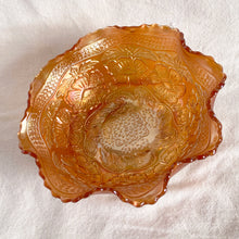 Load image into Gallery viewer, Lovely vintage "Two Flowers" iridescent marigold carnival glass bowl featuring Dogwood and Marsh Lily flowers with fluted edge on three spatulate feet. Crafted by Fenton Art Glass, USA, circa 1920s. A sweet piece for any Fenton collector! In excellent condition, free from chips. Measures 7 5/8 x 3 3/4 inches