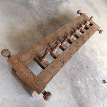 Load image into Gallery viewer, Lovingly handcrafted one-of-a-kind vintage wood wall-hung coat rack, featuring hand carved florals, the phrase "du-te dorule si spune la mandruta vorbe bune", loosely translated mean "they long for good words" and turned pegs. A true piece of old world craftsmanship to enhance your entryway, mudroom, bedroom or bath.
In as found vintage condition, missing one peg.
Measures 36 x 13 x 8 1/2 inches