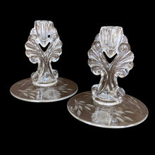 Load image into Gallery viewer, Pair of vintage cut Corn Flower glass clear single lite candlesticks on New Martinsville Glass Janice blanks. Crafted by WJ Hughes, Canada, 1926 - 1970. A lovely way to add sparkle and ambience to your decor.
In excellent condition, no chips.
Measures 5 x 5 1/2 inches
