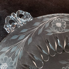 Load image into Gallery viewer, Stunning vintage cut Corn Flower glass serving plate on a Viking Glass blank, shape #4462, features a central set surrounded by six sets of corn flowers and leaf sprays with decorative handles. Crafted by WJ Hughes, Canada 1950s. An elegant serving piece for your favourite desserts. Makes a lovely hostess, wedding or housewarming gift!
In excellent condition, no chips.
Measures 13 inches