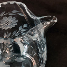 Load image into Gallery viewer, Vintage cut Corn Flower clear glass ice lip pitcher with 3 sets of 12-petalled corn flowers and leaf sprays, beaded rim with applied blown glass open handle. Crafted by WJ Hughes, Canada. An elegant piece for your table or bar service. Makes an excellent gift.
In excellent condition, no cracks.
Measures 6 inches