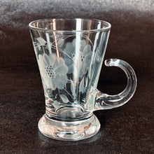 Load image into Gallery viewer, Vintage WJ Hughes cut "Corn Flower" pattern shot glass with two sets of twelve-petal and leaf sprays and applied blown glass open handle. The glass blank was produced by the West Virginia Glass Specialties. This locally cut shot glass is an important part of Toronto's rich history of fine mid-20th century craftsmanship. In excellent condition, free from chips or cracks. Measures 3-1/2"