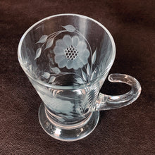 Load image into Gallery viewer, Vintage WJ Hughes cut "Corn Flower" pattern shot glass with two sets of twelve-petal and leaf sprays and applied blown glass open handle. The glass blank was produced by the West Virginia Glass Specialties. This locally cut shot glass is an important part of Toronto's rich history of fine mid-20th century craftsmanship. In excellent condition, free from chips or cracks. Measures 3-1/2"