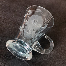 Load image into Gallery viewer, Vintage WJ Hughes cut "Corn Flower" pattern shot glass with two sets of twelve-petal and leaf sprays and applied blown glass open handle. The glass blank was produced by the West Virginia Glass Specialties. This locally cut shot glass is an important part of Toronto's rich history of fine mid-20th century craftsmanship. In excellent condition, free from chips or cracks. Measures 3-1/2"