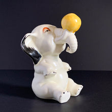 Load image into Gallery viewer, RARE FIND!!!
Adorable art deco white circus elephant balancing yellow ball porcelain figurine. Crafted by Crown Devon, England, 1920s/30s. Perfect for elephant collectors. Also makes a whimsical decor feature in a child's room.
In great vintage condition, no chips/cracks/repairs, minor paint loss. Marked Made in England.
Measures 4 x 5 1/2 inches