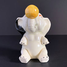 Load image into Gallery viewer, RARE FIND!!!
Adorable art deco white circus elephant balancing yellow ball porcelain figurine. Crafted by Crown Devon, England, 1920s/30s. Perfect for elephant collectors. Also makes a whimsical decor feature in a child's room.
In great vintage condition, no chips/cracks/repairs, minor paint loss. Marked Made in England.
Measures 4 x 5 1/2 inches