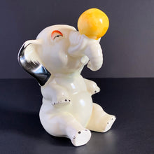 Load image into Gallery viewer, RARE FIND!!!
Adorable art deco white circus elephant balancing yellow ball porcelain figurine. Crafted by Crown Devon, England, 1920s/30s. Perfect for elephant collectors. Also makes a whimsical decor feature in a child's room.
In great vintage condition, no chips/cracks/repairs, minor paint loss. Marked Made in England.
Measures 4 x 5 1/2 inches