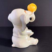Load image into Gallery viewer, RARE FIND!!!
Adorable art deco white circus elephant balancing yellow ball porcelain figurine. Crafted by Crown Devon, England, 1920s/30s. Perfect for elephant collectors. Also makes a whimsical decor feature in a child's room.
In great vintage condition, no chips/cracks/repairs, minor paint loss. Marked Made in England.
Measures 4 x 5 1/2 inches