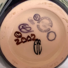 Load image into Gallery viewer, Lovely hand painted vintage "Celtic Web" bud vase designed by Emma Bossons in 2003. Shape 2/4. Hand painted florals on a yellow ground using the raised slip technique made famous by William Moorcroft. Produced by Moorcroft Pottery, Stoke-on-Trent, England. In excellent condition, no chips, cracks or repairs. First quality piece. Maker's marks present, see photos. Purchased from the Moorcroft Pottery shop and offered from our personal collection. Measures 4"