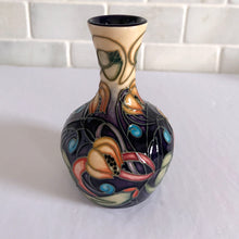 Load image into Gallery viewer, Lovely hand painted vintage "Celtic Web" bud vase designed by Emma Bossons in 2003. Shape 2/4. Hand painted florals on a yellow ground using the raised slip technique made famous by William Moorcroft. Produced by Moorcroft Pottery, Stoke-on-Trent, England. In excellent condition, no chips, cracks or repairs. First quality piece. Maker's marks present, see photos. Purchased from the Moorcroft Pottery shop and offered from our personal collection. Measures 4"