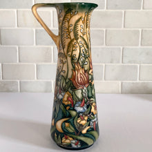 Load image into Gallery viewer, This beautiful "Prairie Summer" ewer pitcher or jug is reminiscent of a summer's day. Designed by Rachel Bishop in 2001 and hand painted over slip glaze on a yellow ground with shades of red, blue, yellow and white on shape JU3. Produced by Moorcroft Pottery, England. In excellent condition, no chips, cracks or repairs. In original box. Purchased directly from the Moorcroft Pottery shop in Stoke-on-Trent, England. Offer from our private collection. Measures 9-1/2"
